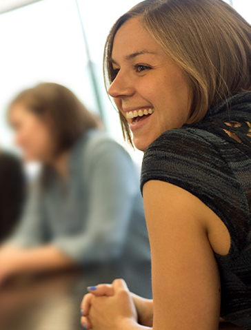 Woman laughing in office
